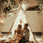 Couple in a tent in the backyard