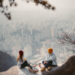 Couple sharing a picnic overlooking the city